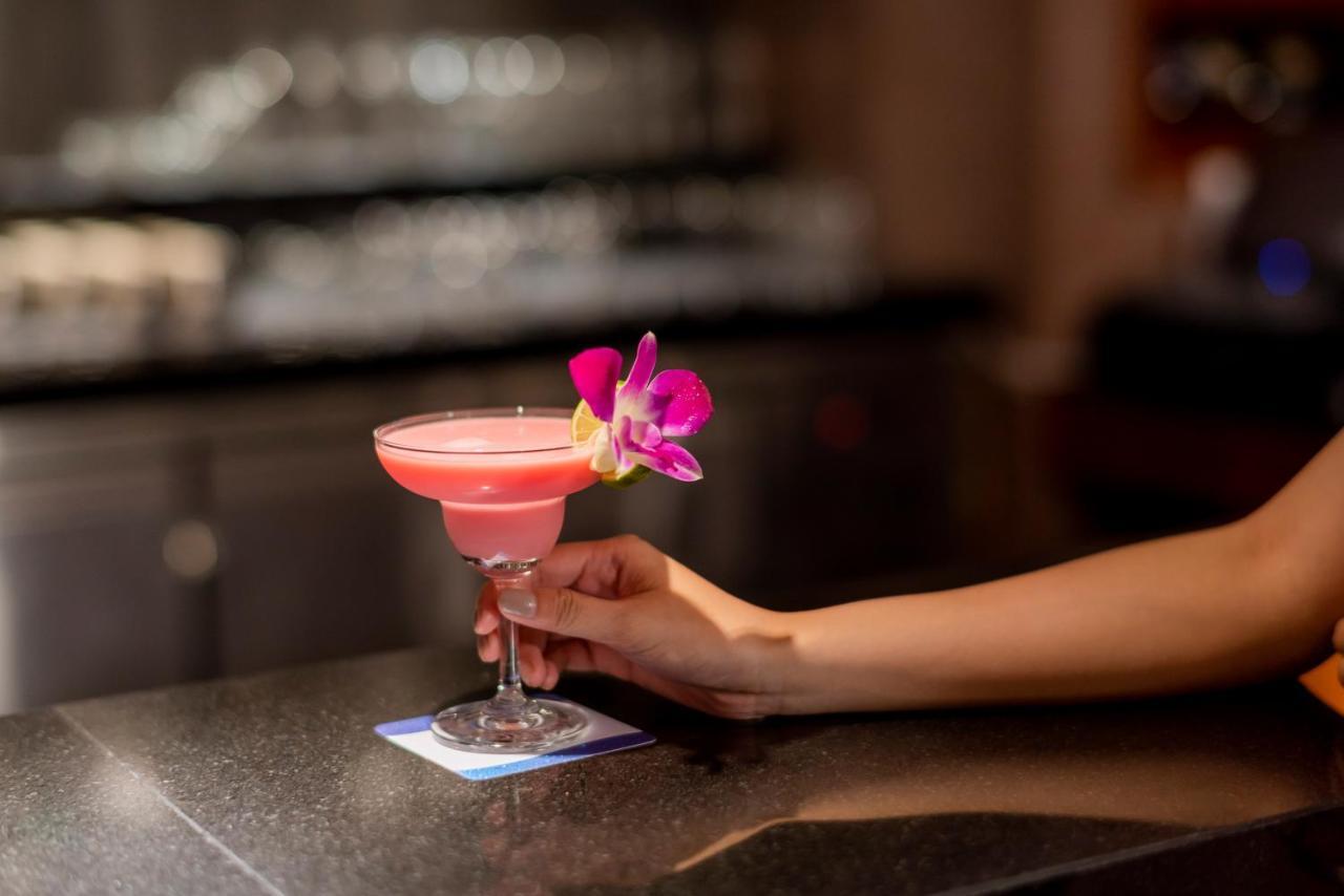 The Empress Premier Chiang Mai - Sha Extra Plus Екстериор снимка A cosmopolitan garnished with a lime and an orchid